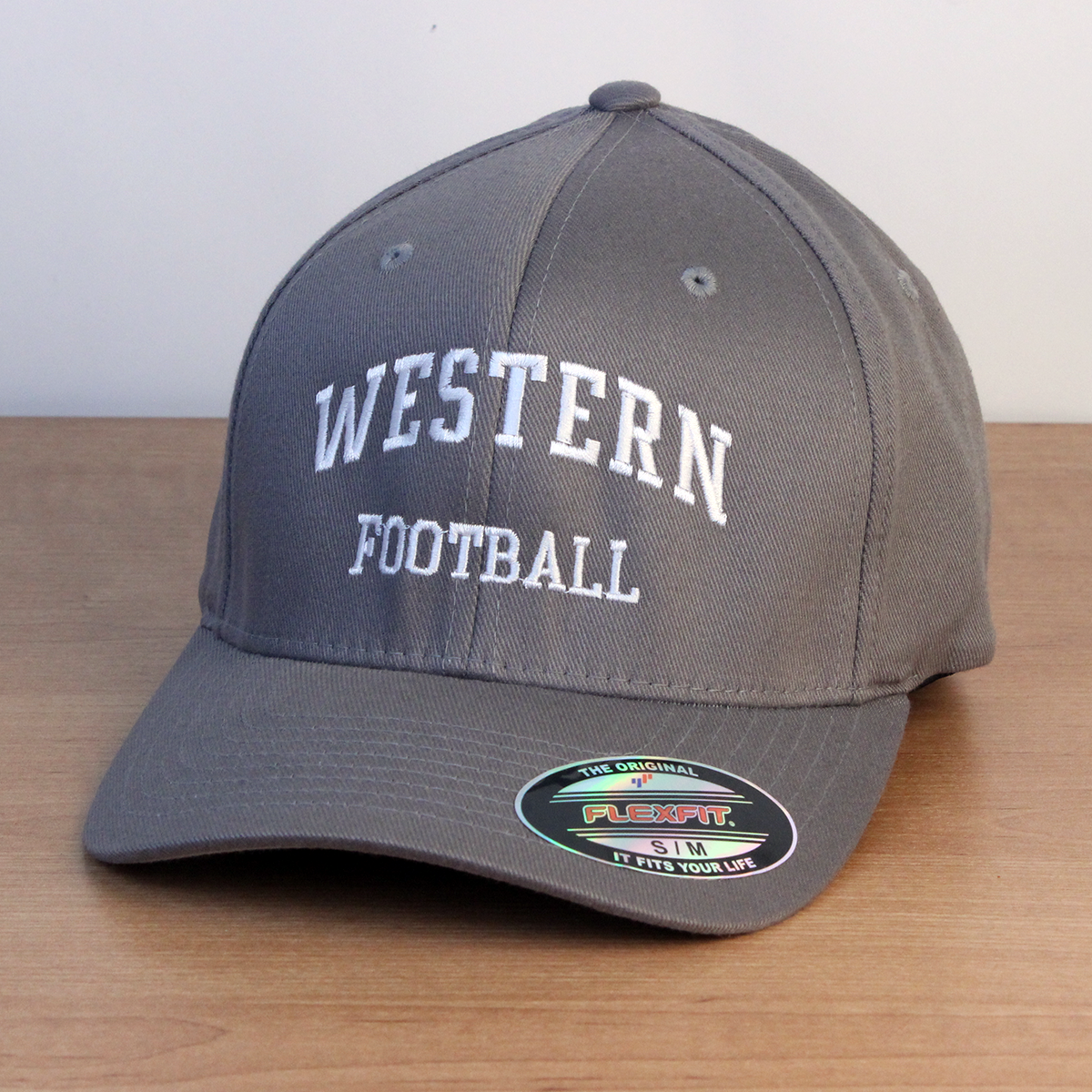 Grey ball cap with Western Football embroidered on the front in white lettering.