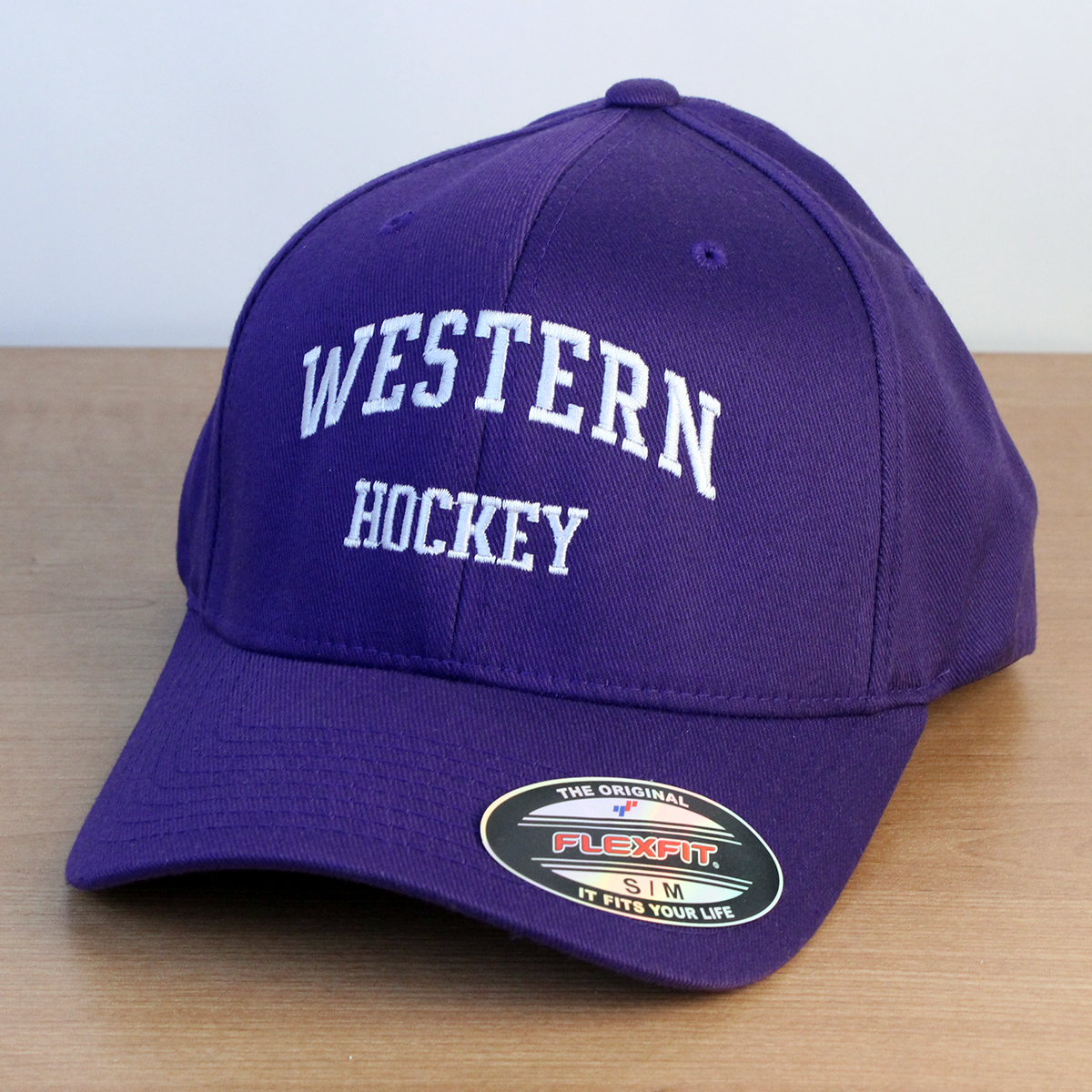 Purple ball cap with Western Hockey embroidered onto the front in white lettering. 