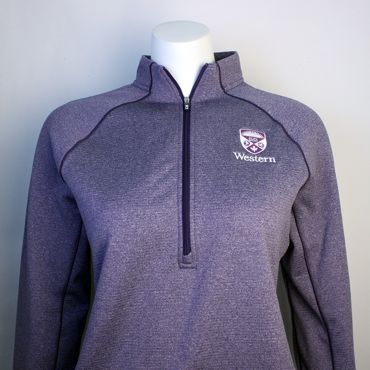 Purple heather textured quarter zip long sleeve with the Western Crest logo and script on the left chest.