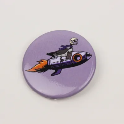 Drawing of Chase the Goose riding on a rocket ship on a round pin.