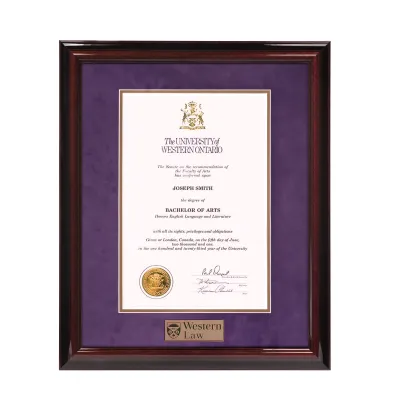 Executive Law Diploma frame with diploma inside. Purple and gold mating. Western Law plaque.