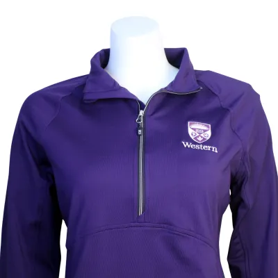 Purple fitted 1/2 zip with Western crest logo printed on the left chest.