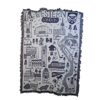 Woven blanket with Julia Gash's Western campus art.