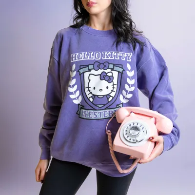 Girl posing with hello kitty sweater and rotary phone