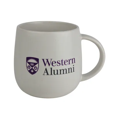 White matte mug with handle. "Western Alumni" and the Western crest logo are printed on the front. 18 oz capacity.