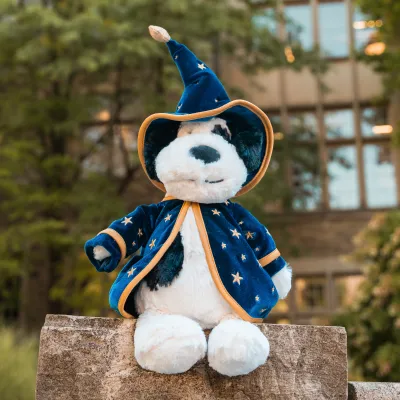 Rufferty Puppy Jellycat sitting in a garden