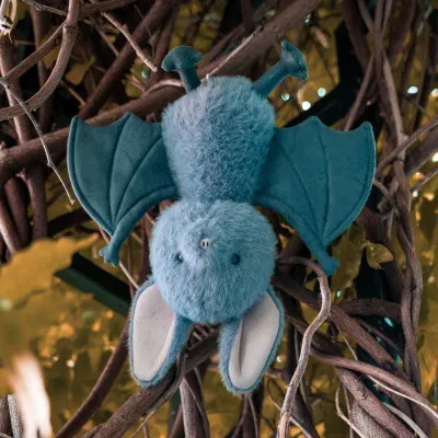 Broox Bat Jellycat hanging from a branch