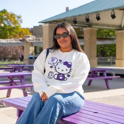Girl sitting in hello kitty apparel