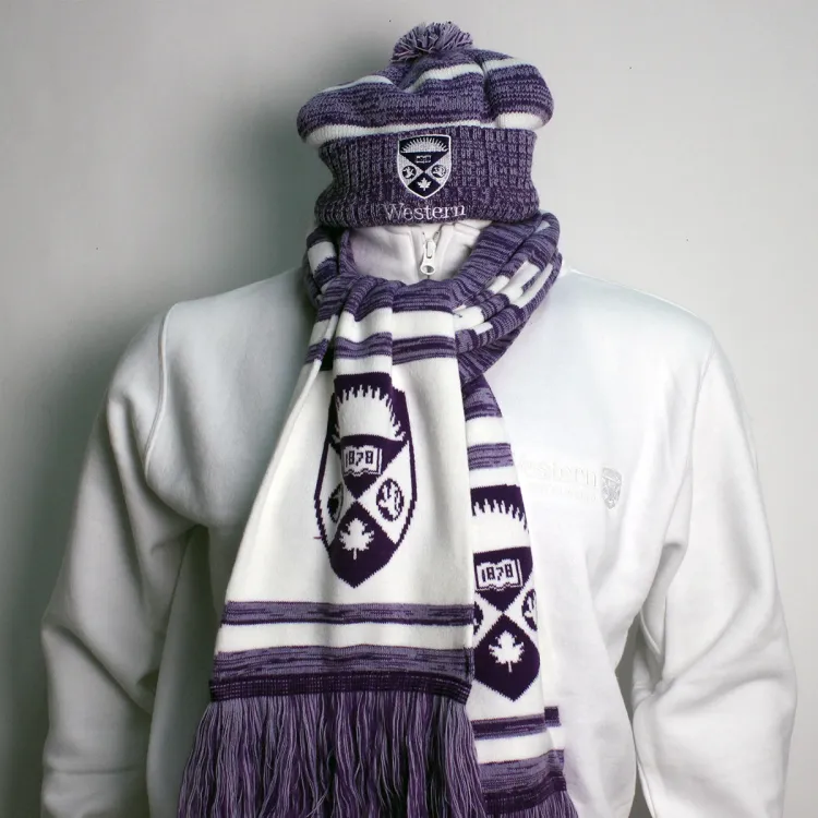 Purple and white toque with embroidered western crest logo paired with the purple and white crest scarf.