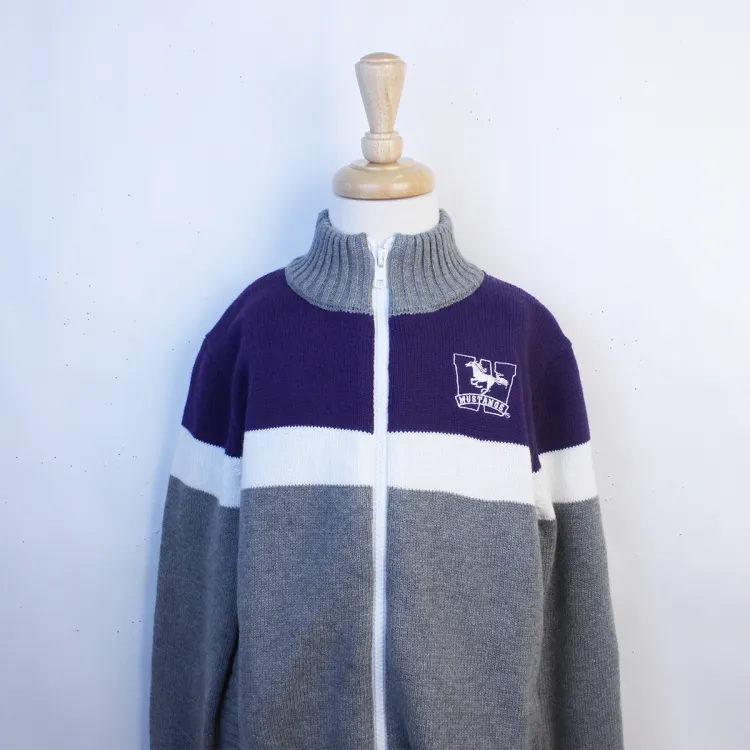 Grey, purple and white colour blocked full zip sweater with high necked color. Western Mustangs logo embroidered on the left chest.