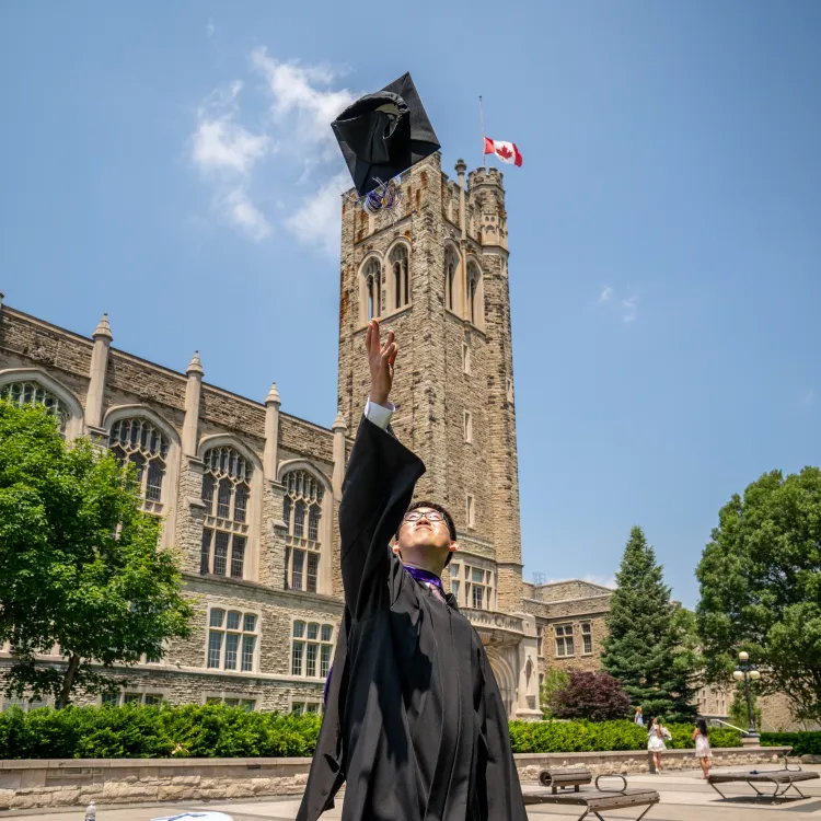 Graduate throwing grad cap