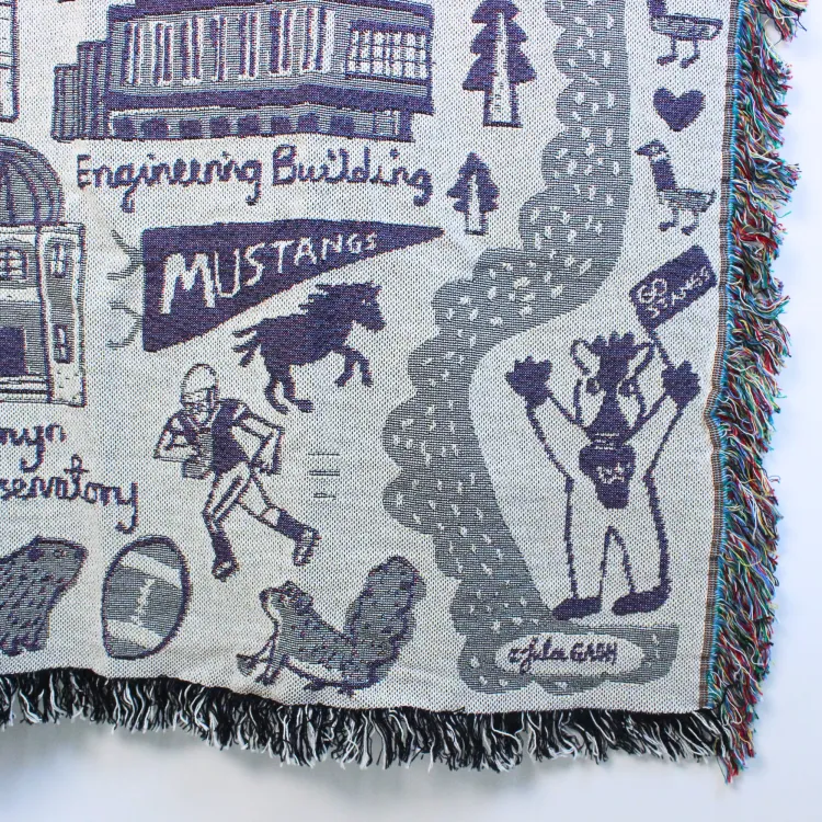 Woven blanket with Julia Gash's Western campus art.