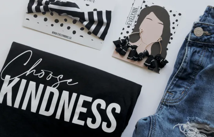 Accessories and clothing laying on table