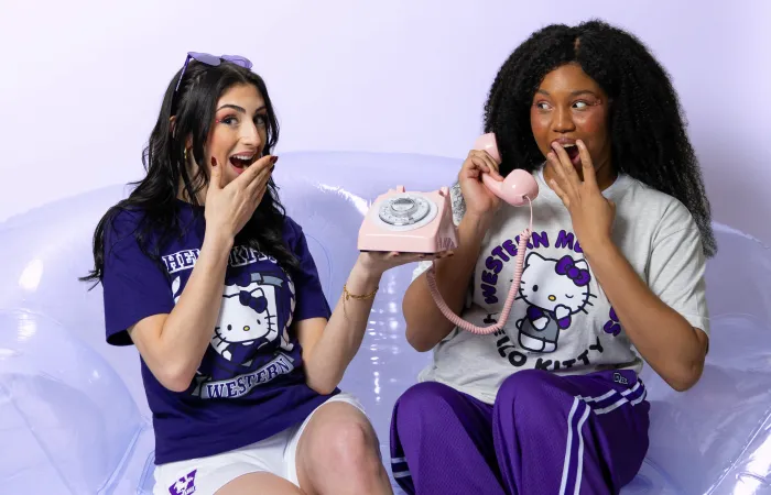 Girls sitting on couch surprised 